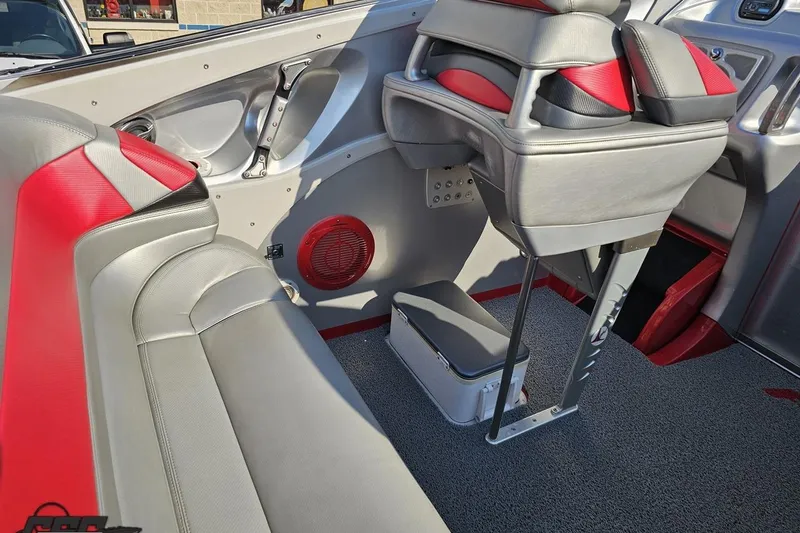 Slide: The Image of Interior of 2011 Sunsation F-4 boat with red and gray seating. - 53