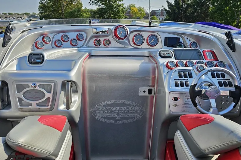 Slide: The Image of Cockpit of 2011 Sunsation F-4 boat with advanced controls and gauges. - 55