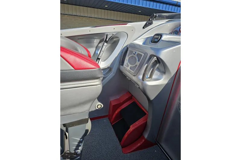 Slide: The Image of Interior of 2011 Sunsation F-4 boat with red and gray seating and dashboard. - 57