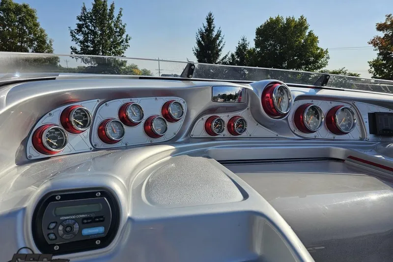 Slide: The Image of Dashboard of a 2011 Sunsation F-4 boat with multiple gauges and controls. - 60