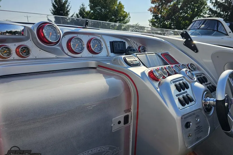 Slide: The Image of Dashboard of a 2011 Sunsation F-4 boat with gauges and controls. - 61