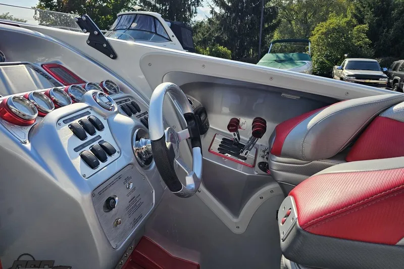Slide: The Image of Interior of 2011 Sunsation F-4 boat with steering wheel and control panel. - 62