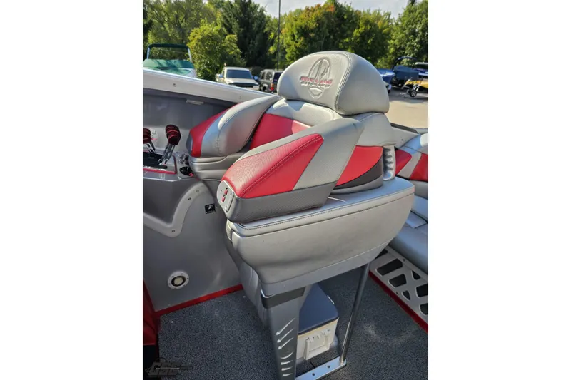 Slide: The Image of 2011 Sunsation F-4 boat interior with red and gray seating, featuring logo embroidery. - 63