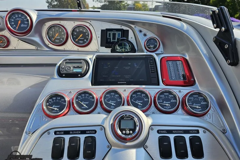 Slide: The Image of Dashboard of a 2011 Sunsation F-4 boat with gauges and controls. - 68
