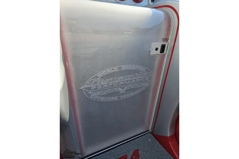 Slide: The Image of 2011 Sunsation F-4 boat interior with logo, featuring sleek design and red accents. - 74