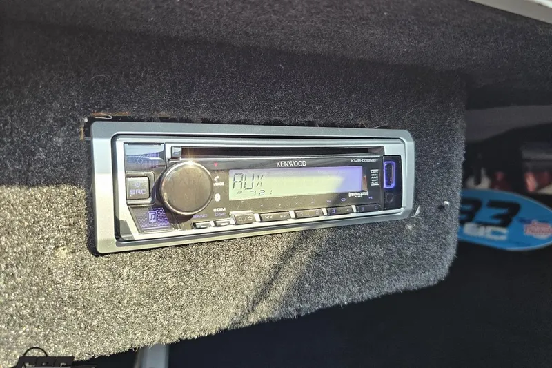 Slide: The Image of Kenwood stereo system in 2011 Sunsation F-4 boat dashboard. - 76