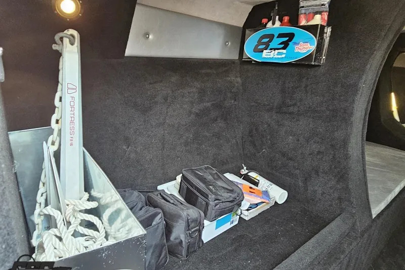 Slide: The Image of Interior storage of 2011 Sunsation F-4 boat with anchor and equipment. - 77
