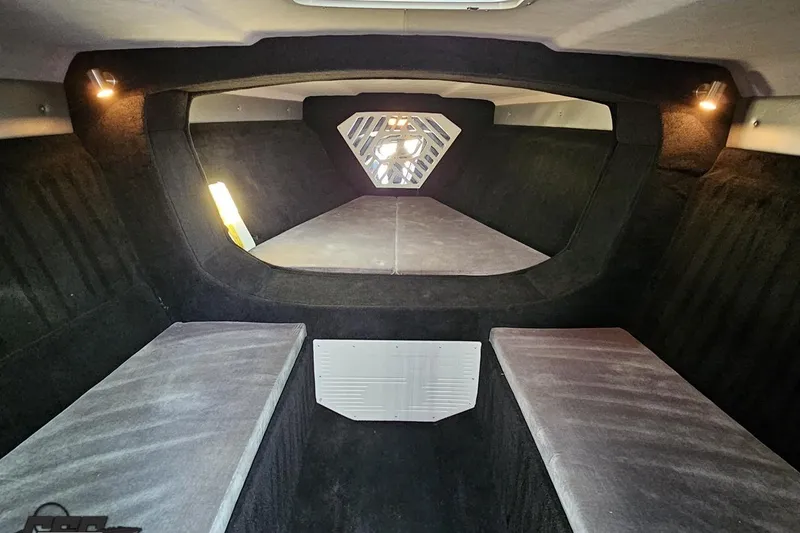 Slide: The Image of 2011 Sunsation F-4 cabin interior with cushioned seating and ambient lighting. - 79