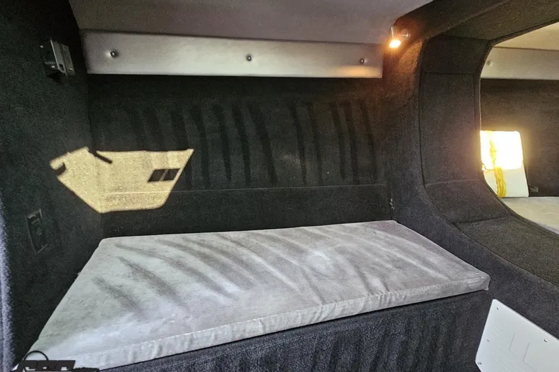 Slide: The Image of 2011 Sunsation F-4 interior cabin with cushioned seating and ambient lighting. - 80