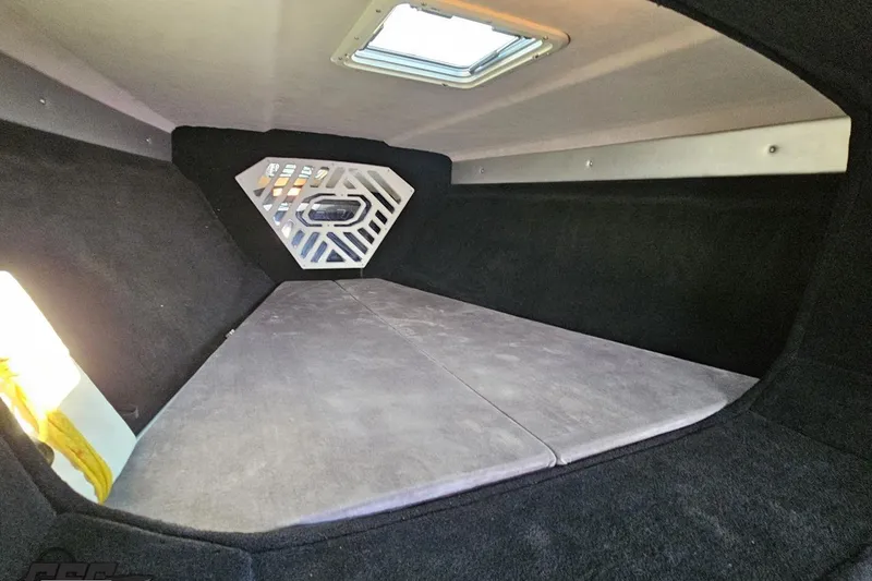 Slide: The Image of 2011 Sunsation F-4 cabin interior with skylight and cushioned seating. - 81