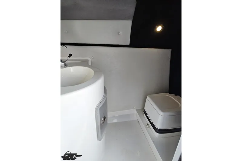 Slide: The Image of 2011 Sunsation F-4 boat interior with sink and compact toilet. - 85