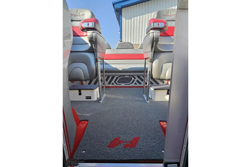 Slide: The Image of Interior of a 2011 Sunsation F-4 boat with stylish seating and carpeted flooring. - 86