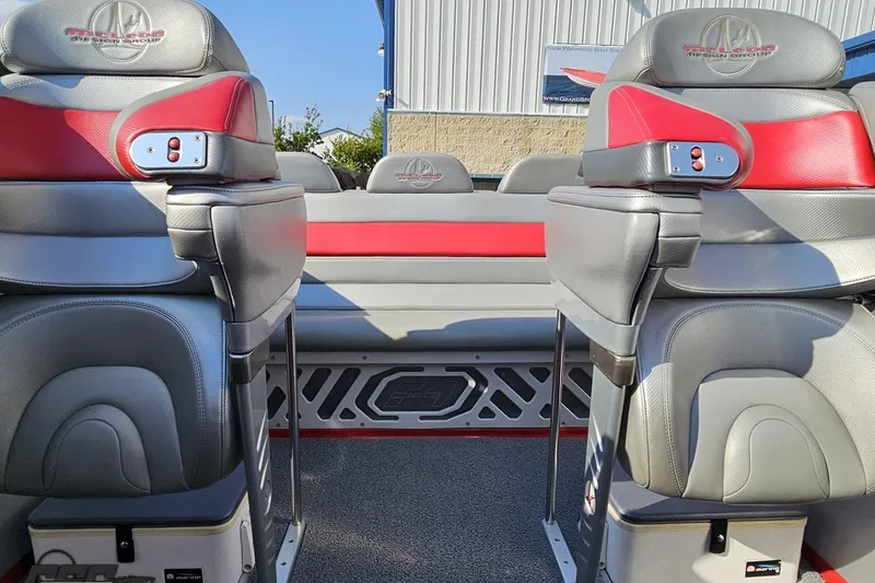Slide: The Image of 2011 Sunsation F-4 boat interior with gray and red seating, showcasing modern design. - 87