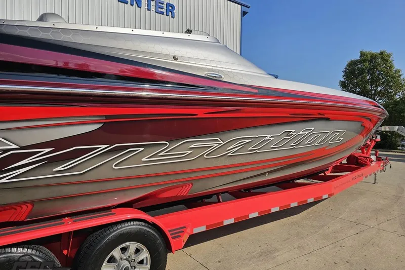 Slide: The Image of 2011 Sunsation F-4 speedboat on red trailer, sleek design, vibrant colors. - 9