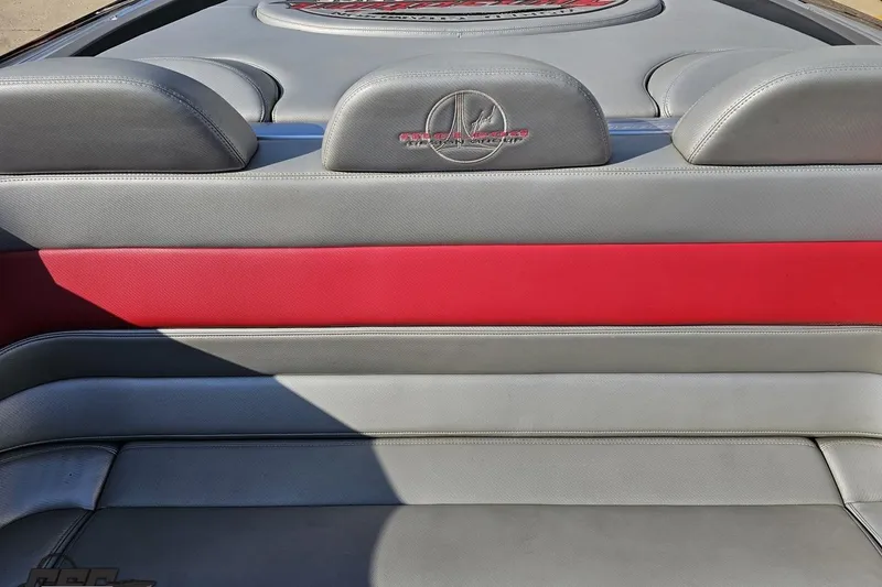 Slide: The Image of 2011 Sunsation F-4 boat interior with gray and red leather seating. - 93
