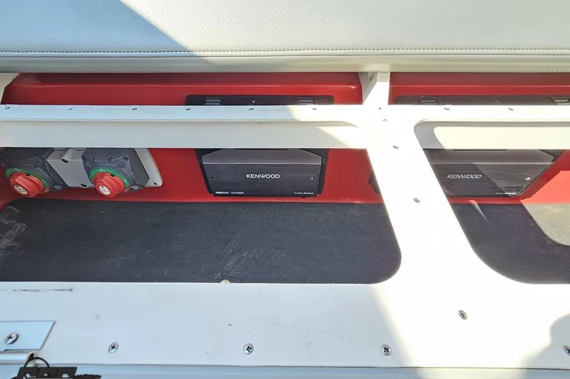 Slide: The Image of 2011 Sunsation F-4 boat interior with Kenwood audio system and control switches. - 94