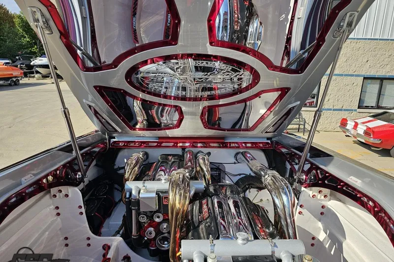 Slide: The Image of Engine compartment of a 2011 Sunsation F-4 boat with polished components and open hatch. - 95