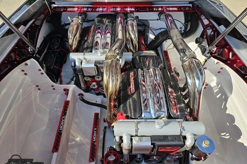 Slide: The Image of Engine compartment of a 2011 Sunsation F-4 boat with dual high-performance engines. - 97