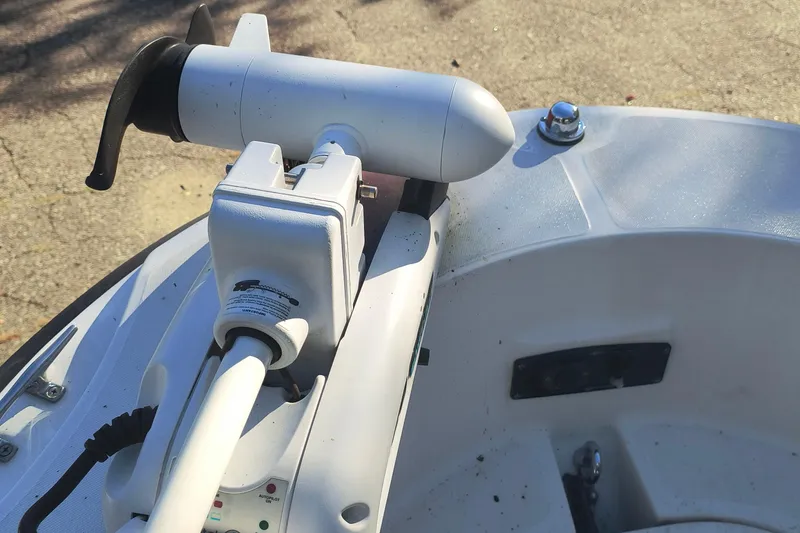 Slide: The Image of Close-up of a 2002 Boston Whaler 180 Dauntless boat's motor and control panel. - 15