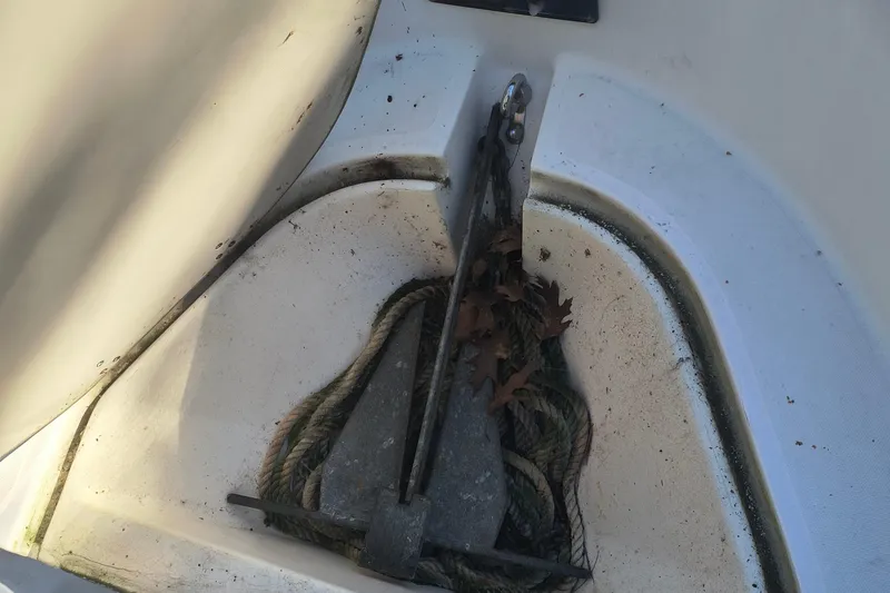 Slide: The Image of Anchor and rope storage on 2002 Boston Whaler 180 Dauntless boat. - 17