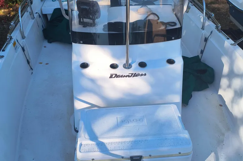 Slide: The Image of 2002 Boston Whaler 180 Dauntless boat interior with cooler and console. - 18