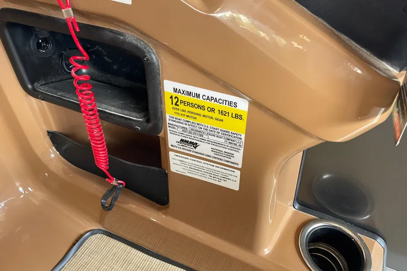 Slide: The Image of 2026 Harris Cruiser 210 boat capacity label, 12 persons or 1621 lbs, interior view. - 14