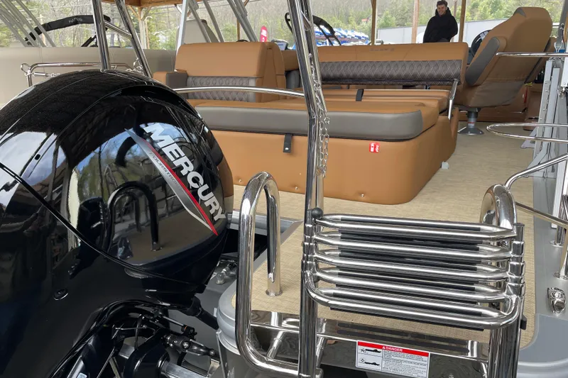 Slide: The Image of 2026 Harris Cruiser 210 boat interior with Mercury engine and luxurious seating. - 15