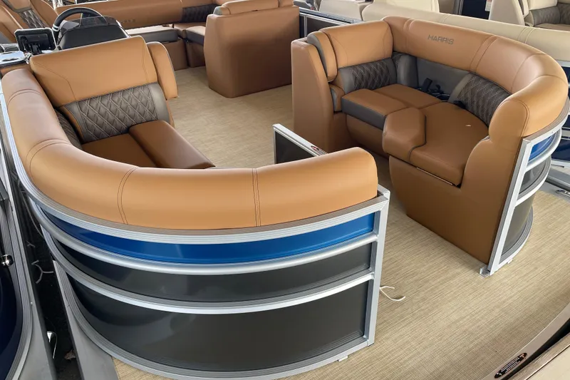 Slide: The Image of Luxurious interior of 2026 Harris Cruiser 210 pontoon boat with plush seating and modern design. - 2
