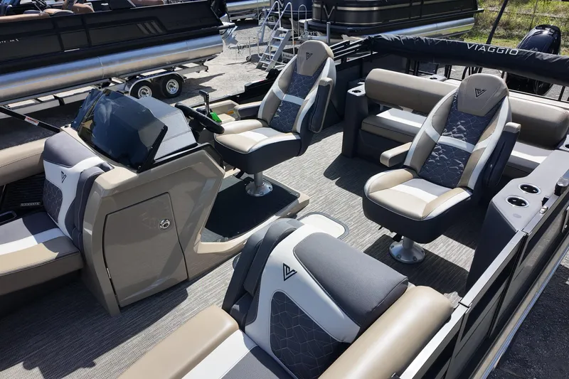 Slide: The Image of 2026 Viaggio Diamante D22S boat interior with modern seating and steering console. - 14