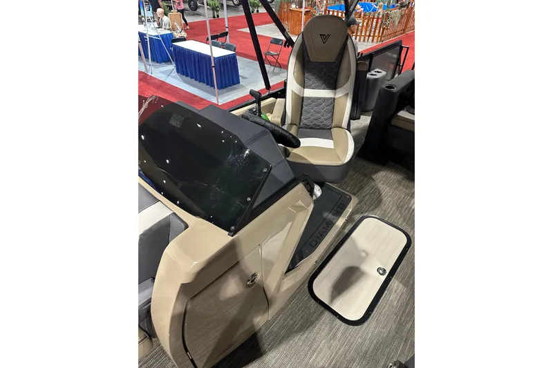 Slide: The Image of 2026 Viaggio Diamante D22S boat interior with modern helm and seating at a boat show. - 18