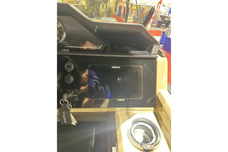 Slide: The Image of Viaggio Diamante D22S 2026 dashboard with Simrad display and ignition keys. - 21