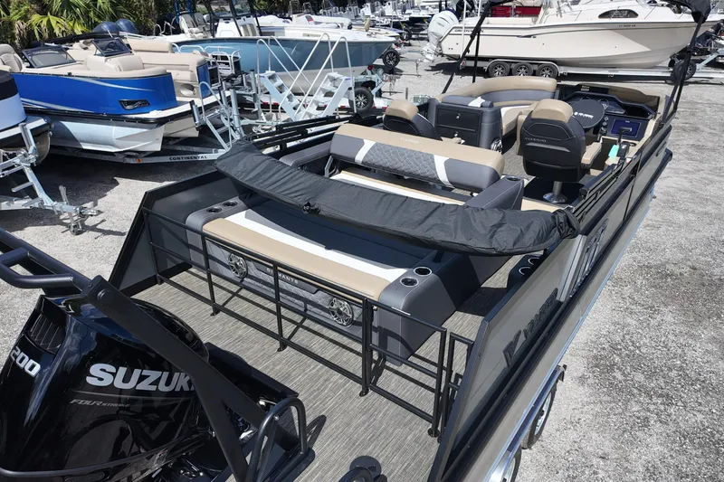Slide: The Image of 2026 Viaggio Diamante D22S boat with Suzuki engine, parked among other boats. - 9