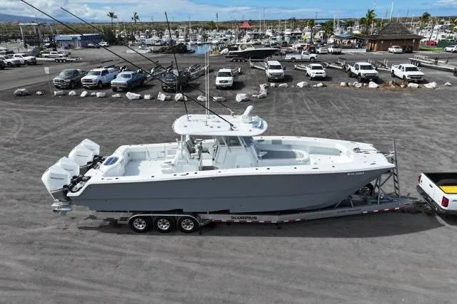 Slide: The Image of 2022 Freeman 37 VH boat on trailer in marina parking lot. - 14