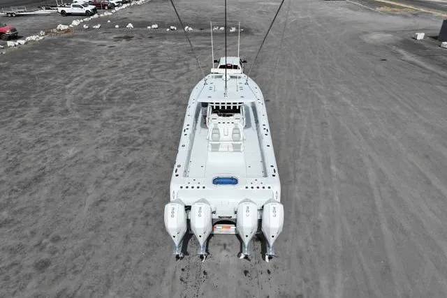Slide: The Image of Aerial view of 2022 Freeman 37 VH boat with four engines on dry land. - 16