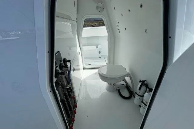 Slide: The Image of Interior of 2022 Freeman 37 VH boat featuring a compact, modern bathroom. - 18