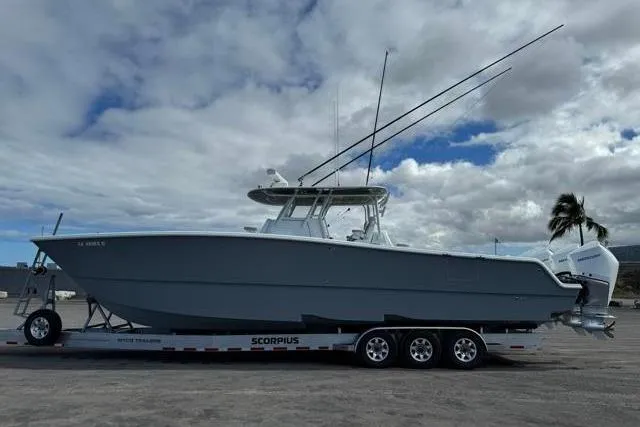 Slide: The Image of 2022 Freeman 37 VH boat on trailer under cloudy sky. - 33