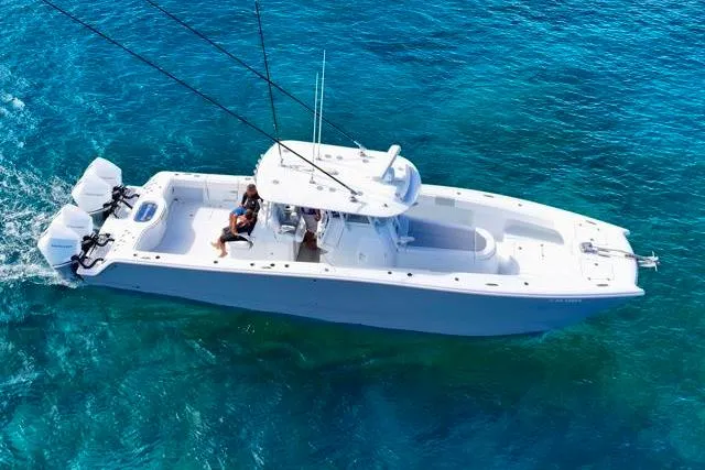 Slide: The Image of 2022 Freeman 37 VH boat cruising on clear blue ocean waters. - 37