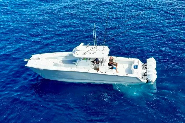 Slide: The Image of Aerial view of 2022 Freeman 37 VH boat cruising on clear blue ocean waters. - 38