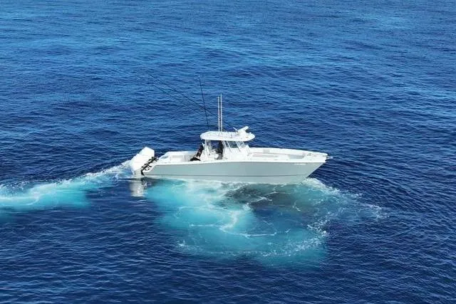Slide: The Image of 2022 Freeman 37 VH boat cruising on open blue ocean waters. - 4