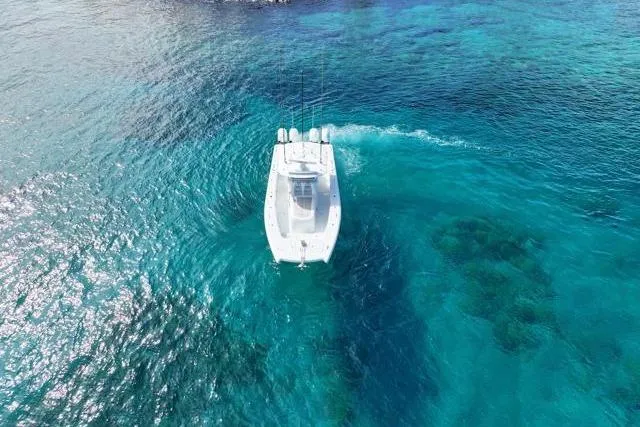 Slide: The Image of Aerial view of 2022 Freeman 37 VH boat cruising in clear blue ocean waters. - 6