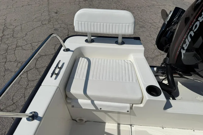 Slide: The Image of 2014 Boston Whaler 210 Montauk boat seat with Mercury engine, white upholstery. - 19