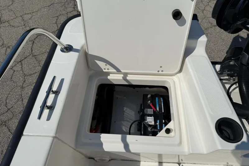Slide: The Image of 2014 Boston Whaler 210 Montauk boat battery compartment with open hatch. - 20