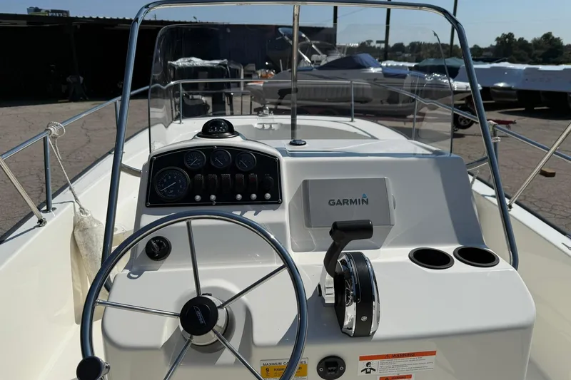 Slide: The Image of 2014 Boston Whaler 210 Montauk boat dashboard with Garmin navigation system. - 8
