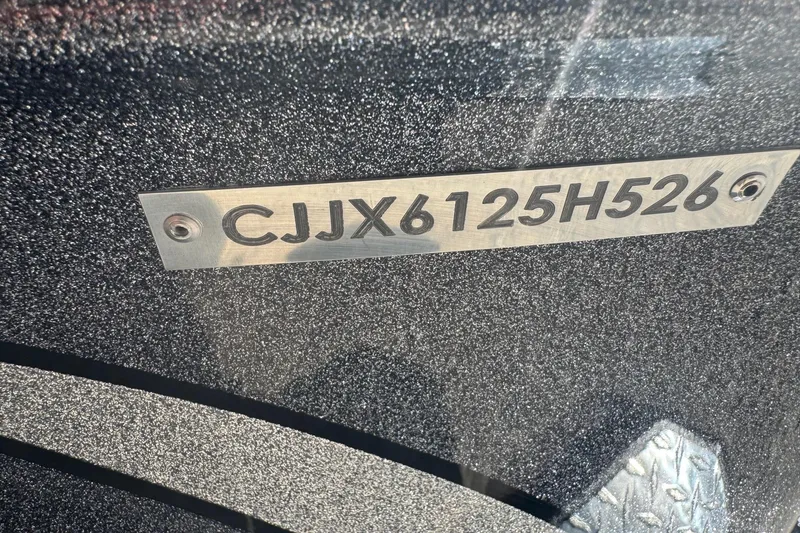 Slide: The Image of VIN plate on a 2026 Phoenix 21XE boat, displaying "CJX6125H526". - 11