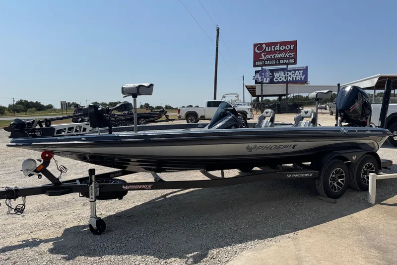 Slide: The Image of 2026 Phoenix 21XE boat on trailer at outdoor dealership, sunny day. - 3