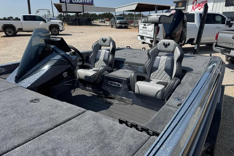 Slide: The Image of 2026 Phoenix 21XE boat interior with sleek seats and modern dashboard design. - 6