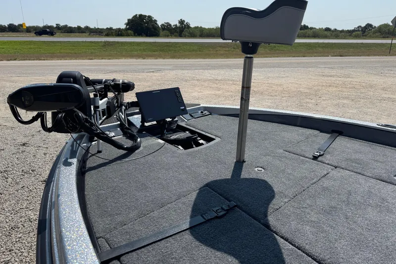 Slide: The Image of 2026 Phoenix 21XE boat deck with advanced navigation equipment and seating. - 8