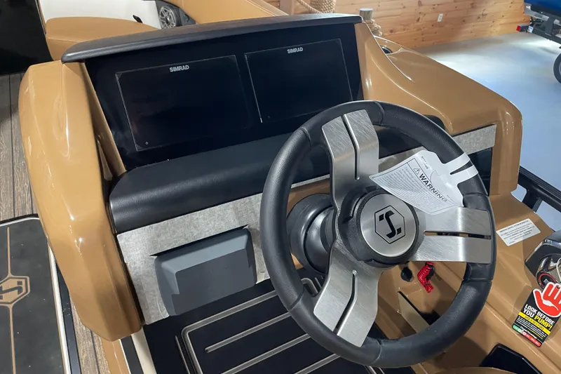 Slide: The Image of Steering console of 2026 Harris Solstice 230 boat with dual Simrad displays. - 10