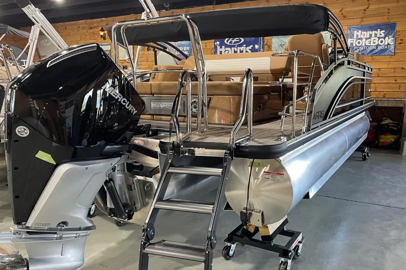 Slide: The Image of 2026 Harris Solstice 230 pontoon boat with Mercury engine in showroom. - 3