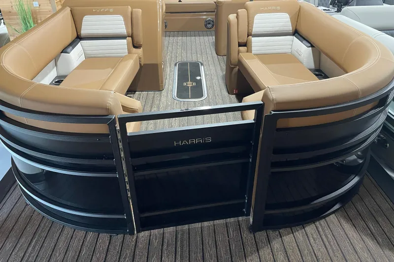 Slide: The Image of 2026 Harris Solstice 230 pontoon boat with tan seating and sleek black railing. - 4